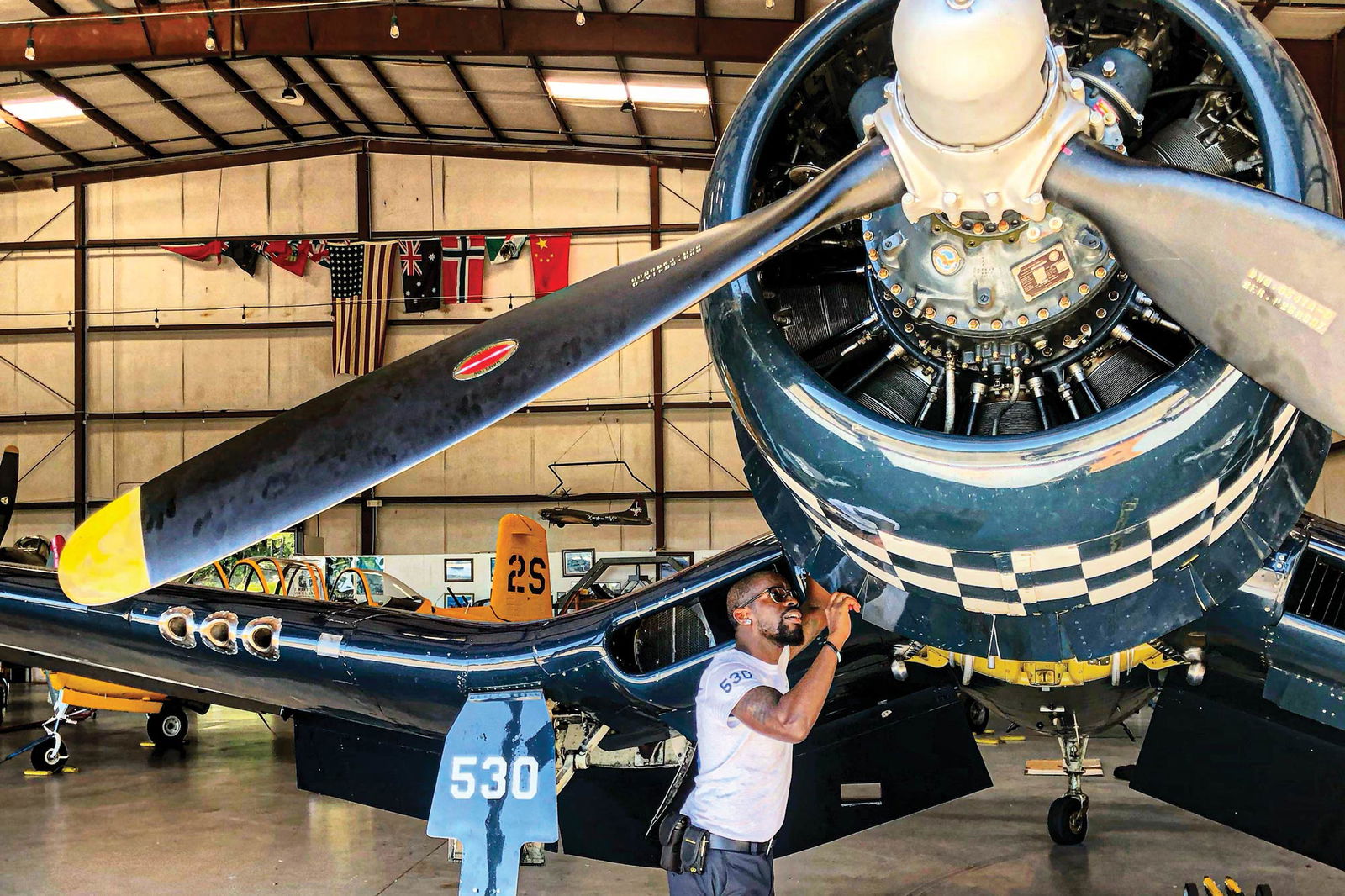 Melvin Williams working on a vintage aircraft