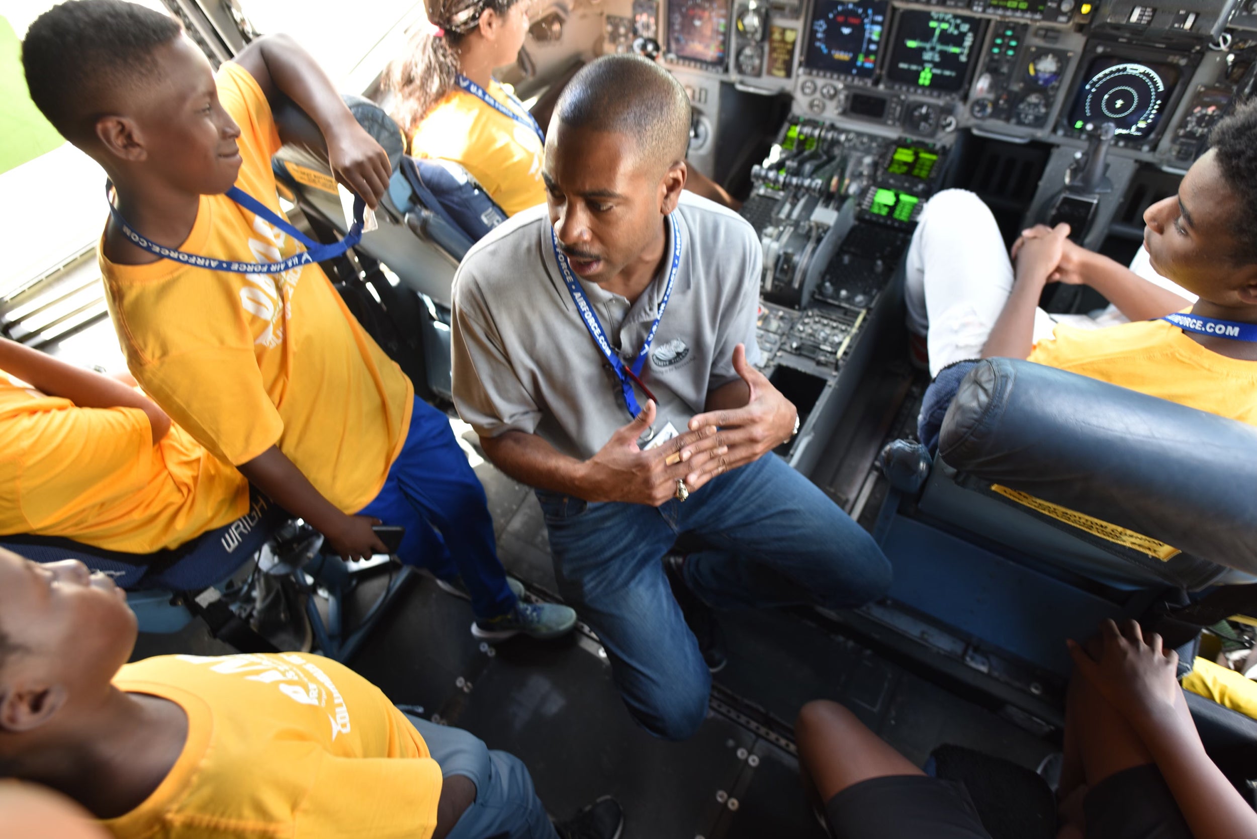 C-17 pilot Andrew Pierce gives students a tour of the C-17 flight deck