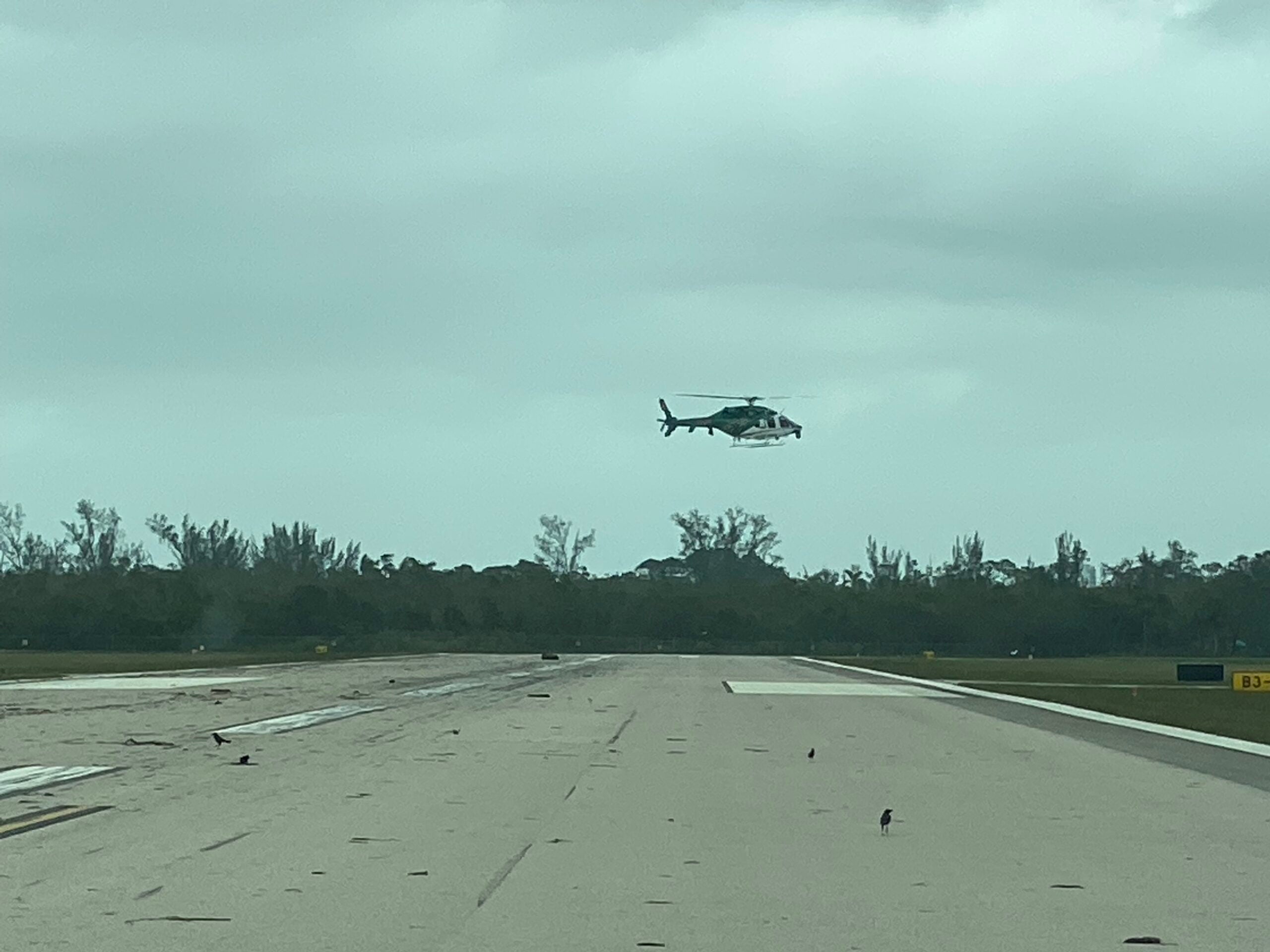 Helicopter hovering over Naples Airport