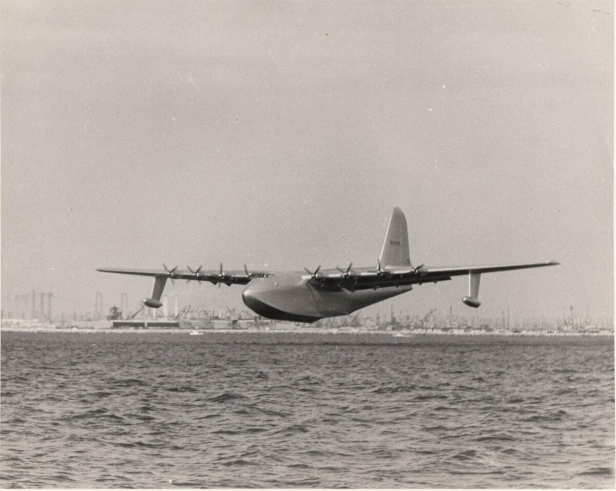 An historic image of the aircraft that would become known as the Spruce Goose, as it starts to lift off the water for its one and only flight.