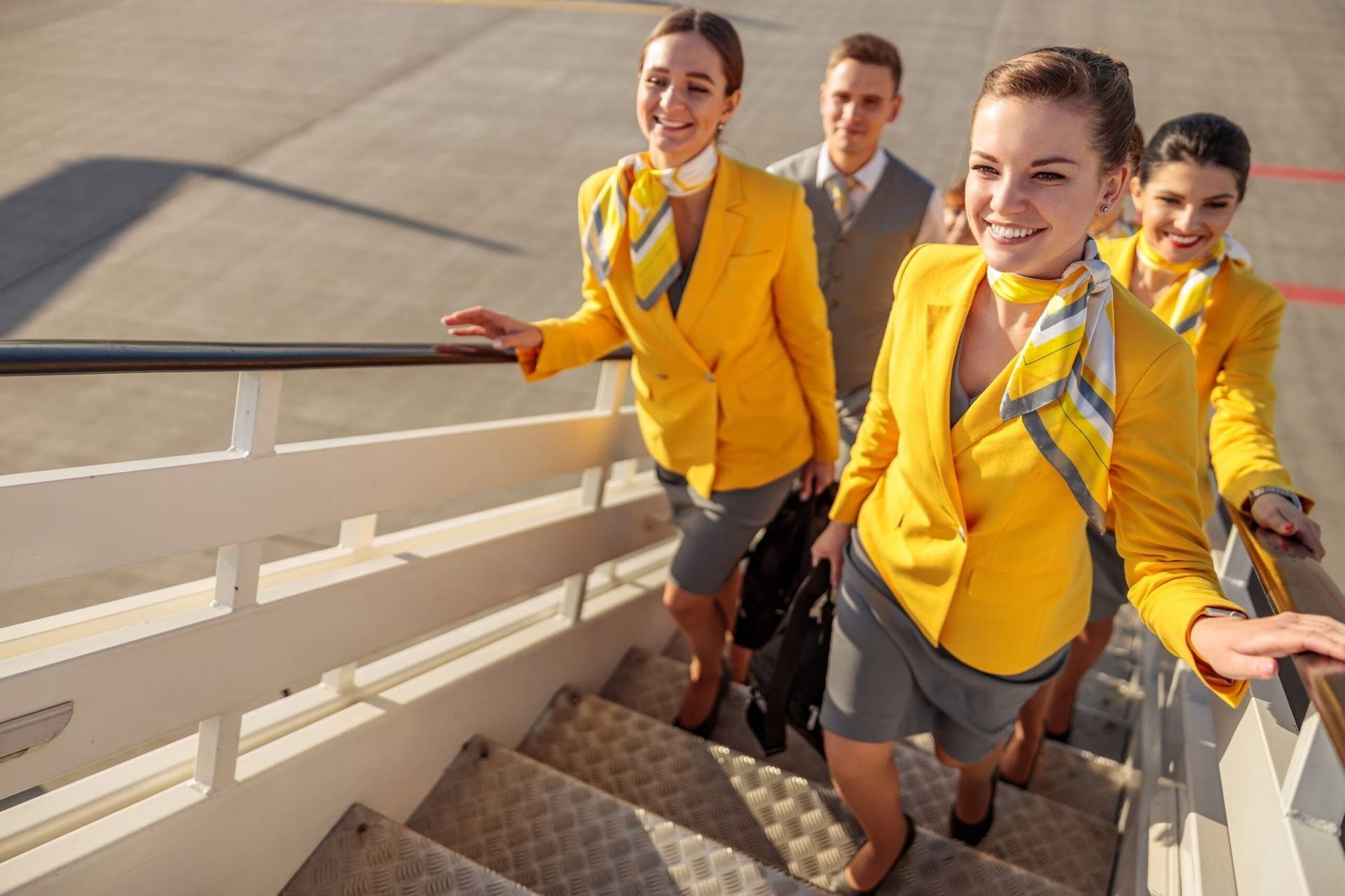 Flight attendants boarding an airplane
