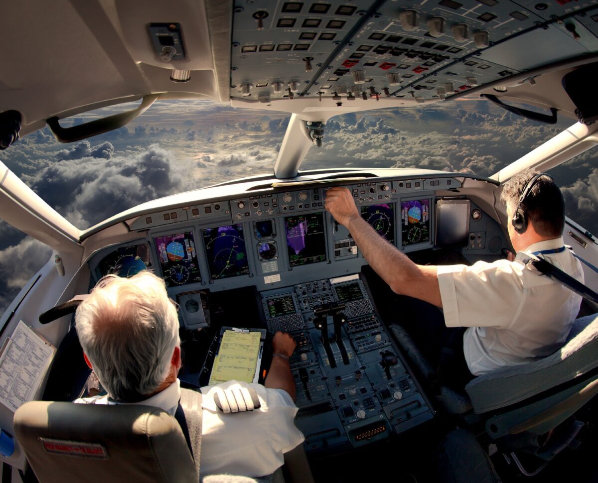 Pilots in an aircraft cockpit.