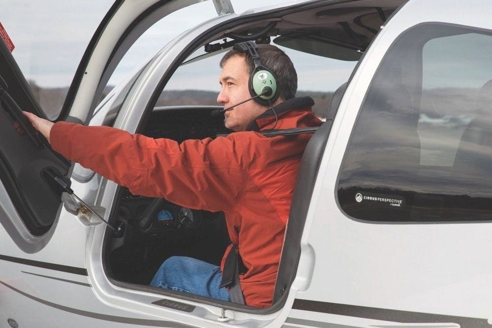 Pilot wearing David Clark headset.