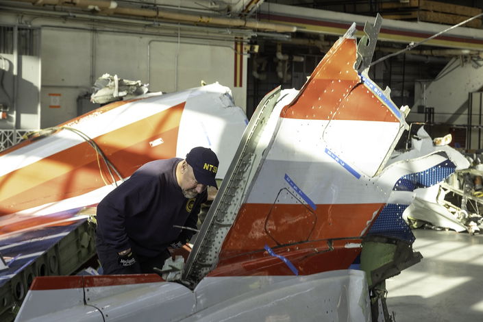 NTSB investigators inspect wreckage of CRJ-700