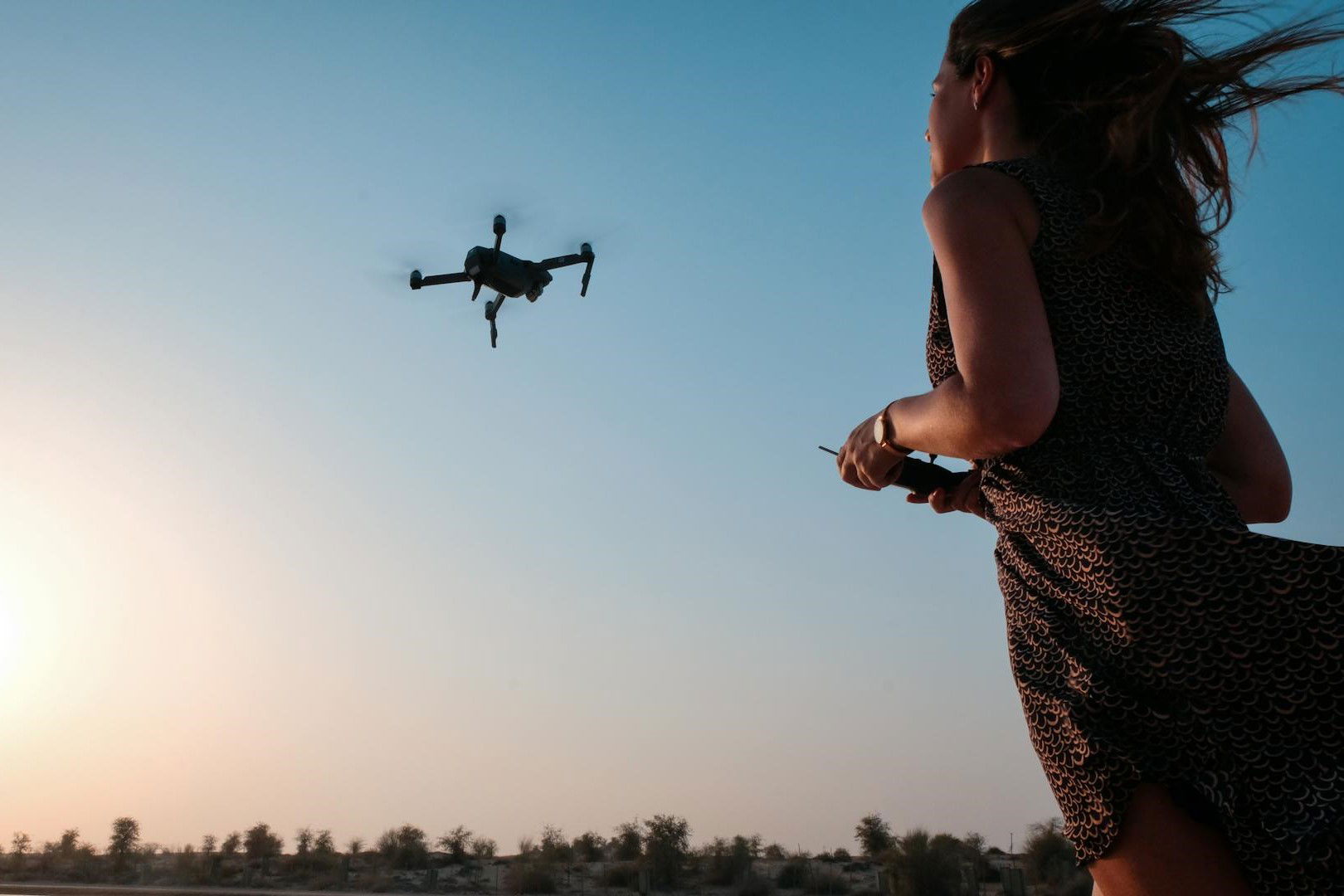 Woman flying a drone