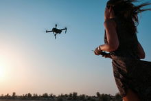 Woman flying a drone