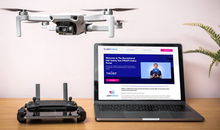 Desk with drone school program on computer