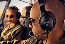 Pilot wearing Bose A30 aviation headset