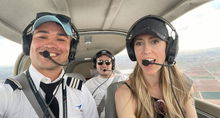 Three aviators wearing headsets.